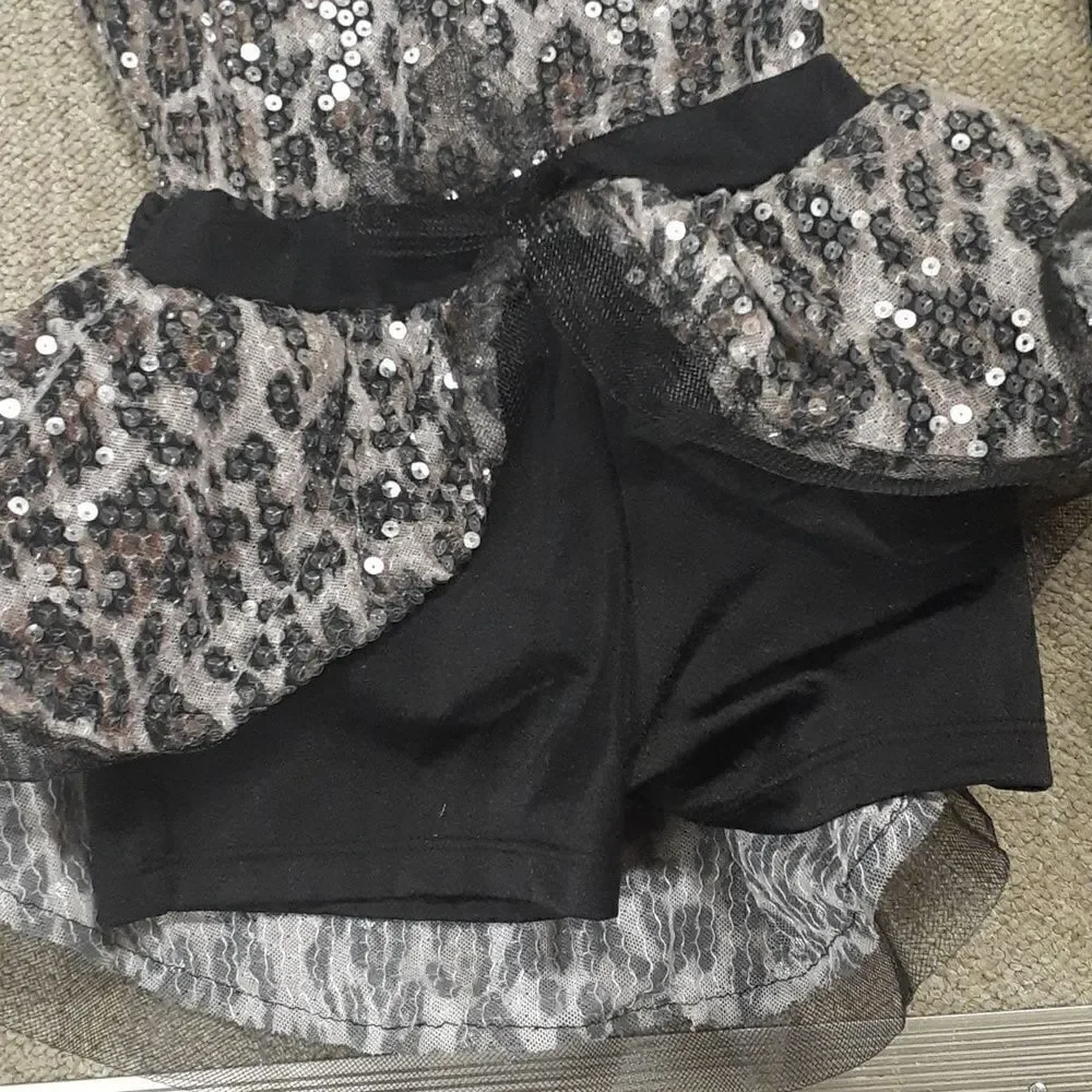 Beautiful leopard black and pink dance leotard and black tights‎ to go with it.